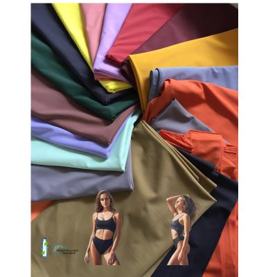 China Anti-Bacteria Recycled 108 Solid Colors For 4 Way 80% Stretch 200gsm Nylon 20% Spandex Matte Weight For Swimwear Spandex Fabric for sale