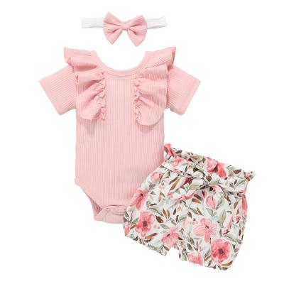 China Anti-Shrink Newborn Baby Girl Clothes Ruffle Romper Top And Flower Print Short Sleeved Ribbed Baby Romper Outfits Set for sale