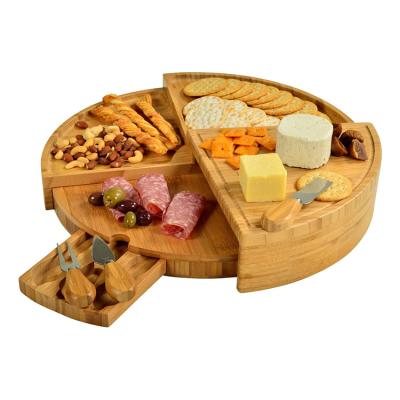 China Factory Sustainable Custom Round Bamboo Cheese Board With 3 Piece Cheese Knife Set And Slide Storage Tray for sale