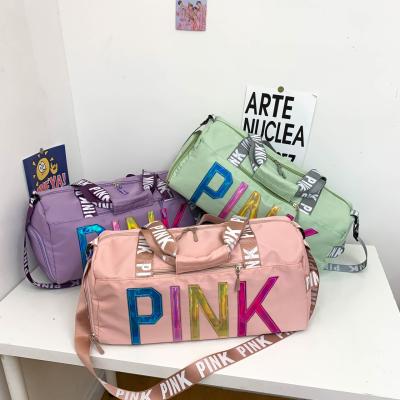 China Fashion In Pink Running Gym Fashion Duffel Bag Outdoor Travel Bag For Women Luggage Bag for sale