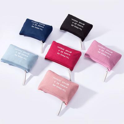 China Fashion Simple Design Solid Color Zipper Makeup Bags Fashion Canvas Cosmetic Bag With Letters for sale