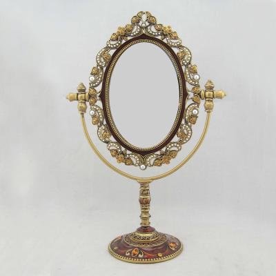 China Vintage Decorative Gold Swing Single Sided Table Zinc Alloy Framed Oval Mirror with White Amber Hand Epoxy Gold Rhinestones ABS Beads for sale