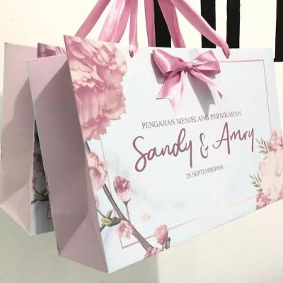 China New Products Boutique Recyclable Gift Packaging Bag Kraft Paper Shopping Bag Printed Logo Luxury Shopping Gift Bag With Ribbon Bow Tie for sale