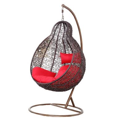 China Modern PE Rattan Bird Nest Swing Chair Wicker Hanging Garden Chair With Metal Stand for sale