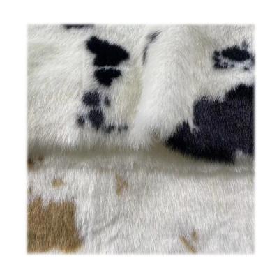 China Wholesale Mink Fancy Animal Faux Fur Cow Pattern Upholstery Faux Mink Fur Jacquard Auto Fabric Luxury Stockings For Clothing for sale