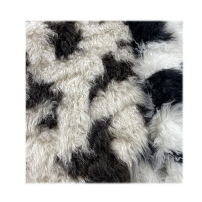 China Auto Wholesale Faux Sheepskin Curly Fabric Acrylic Faux Fur 1400g Wool Faux Fur Lamp Upholstery Long Pile Women Coat Spray for sale