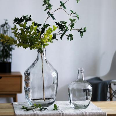 China Fashionable Bud Glass Vase 2021 Minimalist Hand Transparent Vase Large Modern Irregular Vase Clear Decorative Big Bellied Nordic Swollen for sale