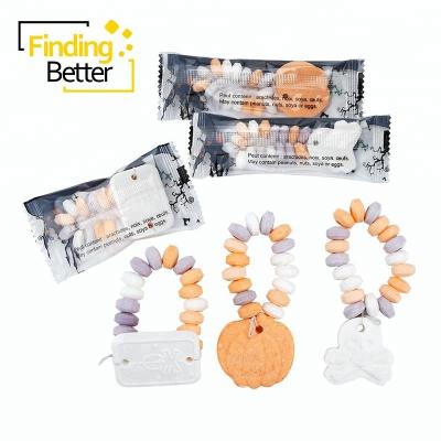 China Natural Halal Watch Pumpkin Shape Press Hard Candy Halloween Wristband Arm Compress Skeleton Candy for sale