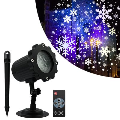 China Proyector de Navidad luces de control remoto Decoración de vacaciones Ip65 Proyección a prueba de agua al aire libre Copos de nieve lámpara luz de nieve en venta