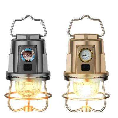 China 2024 Más popular Venta caliente Portátil colgante Iluminación cálida y fría Luces de fuego atmósfera Retro Led Camping Light con reloj en venta