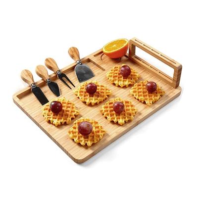 China Amazon Sustainable Hot Custom Wooden Bamboo Cheese Board Set With Cutlery In Slide Out Drawer Cheese Tray Cutting Board for sale