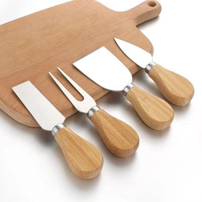 China Sustainable Stainless Steel Cheese Knives Oak Handle Cheese Board Butter Cutter Spatula Kitchen Cheese Tools for sale