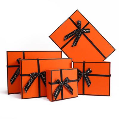 China Wholesale Biodegradable Orange Paper Gift Box With Black Ribbon Bow Tie For Cosmetic Luxury Christmas Wedding Gifts Clothing Dress Packaging for sale