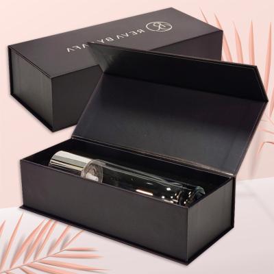 China Recycled Materials Logo Gift Black Box For Essence Oil Tube Custom Cosmetic Perfume Bottle Eye Luxury Magnetic Box With Foam Inserts for sale