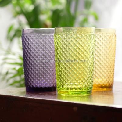 China Cheap Colorful Embossed Diamond Glass Cup Handmade Stemless Traditional for sale