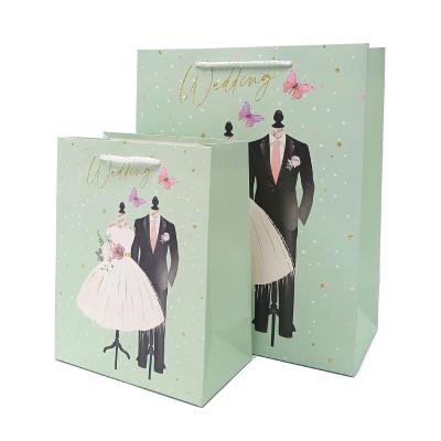 China Stain Biodegradable Wholesale Wedding Cardboard Green Paper Cosmetic Bag For Wedding for sale