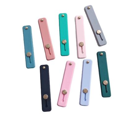 China Universal Finger Kickstand Mobile Phone Finger Grip Strap Waterproof Finger Grip Holder Strap Phone Strap for sale