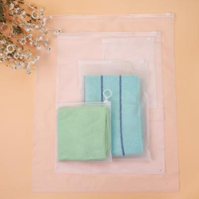 China Recyclable Custom Logo Matte Self Seal Apparel Packaging Transparent Frosted Zipper Plastic Bag for sale