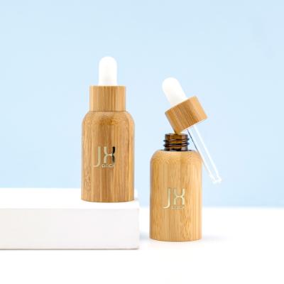 China 20ml 50ml 100ml round 100% empty bamboo cosmetic hiar serum oil packaging glass dropper bottlte face bamboo material for sale