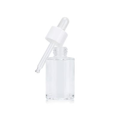 China 50ml high quality cosmetic 1.7 oz empty transparent round essential oil cosmetic glass dropper bottle for sale