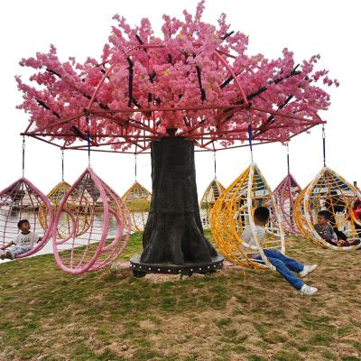 China Realistic 5m Tall Rotating Artificial Cherry Blossom Trees With Swing Chair For Promotion for sale