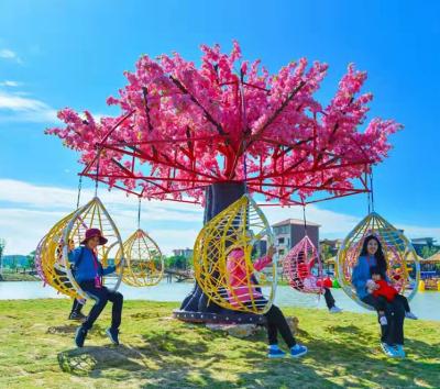 China Realistic 5m Tall Rotating Artificial Cherry Blossom Trees With Swing Chair For Events for sale