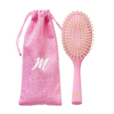 China Eco-friendly Nondisposable Natural Scalp Massage Detangling Wooden Pink Hair Brush For Women With Custom Logo for sale