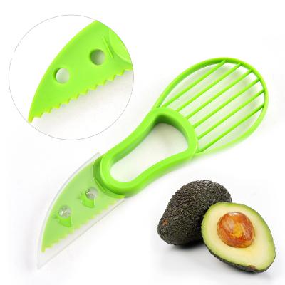 China Sustainable Fruit Vegetable Kitchen Multi Function Tools Plastic Avocado Cutter 3 In 1 Avocado Slicer for sale