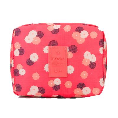 China 2022 Hot Selling Small Portable Cosmetic Bag Square Travel Large Capacity Cube Flower Printing Cosmetic Bag Type Cosmetic Bag for sale