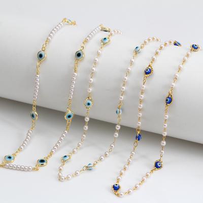 China Fashion Lotus 18K Gold Plated Freshwater Pearl Evil Eye Sweater Chain Necklace for sale