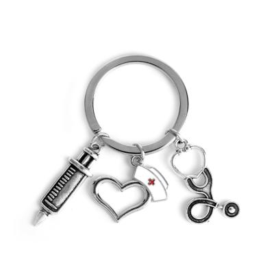 China Trendy Metal Stethoscope Keychains Medical Letter She Believed She Could So She Doctor Metal Doctor Key Chains For Women Man Gift for sale