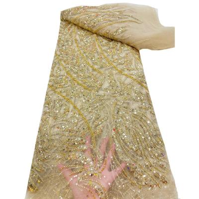 China Viable Nigerian Gold Beaded Wedding Dress French Lace Fabric French Lace Fabric With Beads for sale