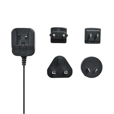 China Interchangeable ABS Wall-mount 5V 1A Plug AC DC Solar Power Adapter for sale