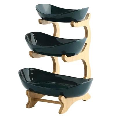 China Sustainable Bowl Hot-selling Ceramic Oval Fruit Basket With Holder Bamboo Snack Tray For Home Storage for sale