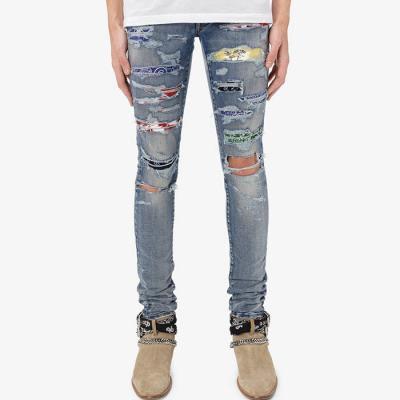 China Slim fit denim fabric man pants patchwork distress blue stacked skinny trousers stacked skinny trousers ripped custom mens jeans for sale