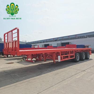 China The truck trailer the annual sales of the flatbed semi-trailer using 4 axle heavy machinery suspension is more than 10000 for sale