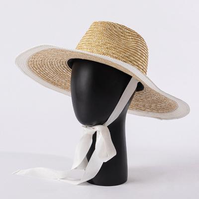 China Luxury Brand Cowboy Beach Designer Big Brim Fashion Summer Beach Straw Hat Long Strap Ladies Hats For Women for sale