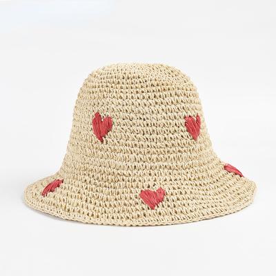 China Breathable Beach Hand Weave Bucket Straw Hat Love Embroidered Travel Sun Hat For Women Vacation Beach Foldable Hat for sale