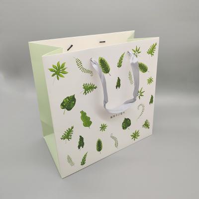 China Recyclable Your Logo Size Hot Stamping Customized Paper Carrier Bags for sale