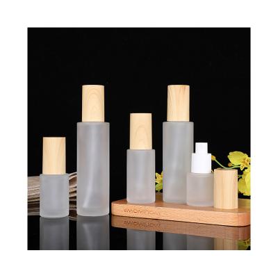 China Personal Care Frosted transparency Cosmetic Packaging bamboo spray bottle bamboo pump bottle glass bottle for sale