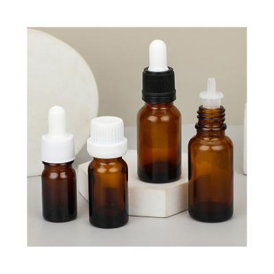 China Cosmetic dropper amber color mini clear glass roller bottles for essential oil 100ml glass essential oil bottle for sale