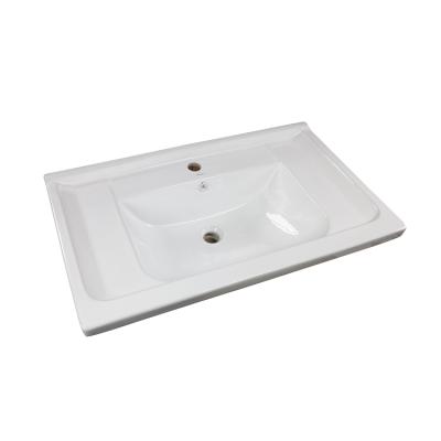 China HEGII Modern Durable Ceramic Handmade Sink Factory Direct Glossy White Glazed Countertop Wash Basin for sale