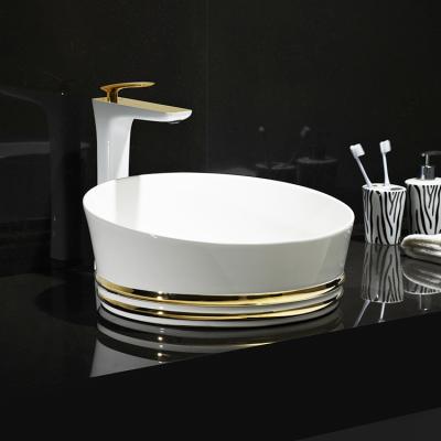 China HEGII Bathroom Sink White Gold White Gold Bathroom Vessel Art Face Hand Ceramic Wash Basin Luxury Modern Countertop Wash Basin With Gold Line for sale