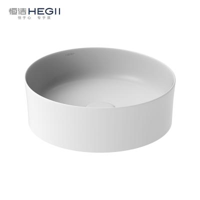 China HEGII Customized Modern Matte Color Slim Edge Round Sink Ceramic Bowl Bathroom Basin Art Top Table Face Small Hand Wash Basin for sale