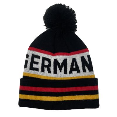 China JOINT Custom Football Team Country Jacquard Logo Beanies Hat With Colorful Pom Pom for sale