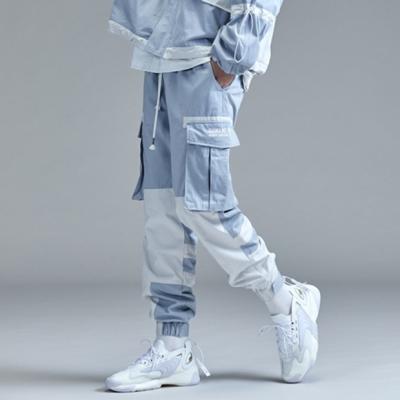 China Breathable Custom printed plain bulk patchwork blue high waisted street wear trousers stacked multi pocket men cargo pants for sale