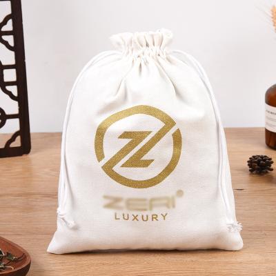 China Customized Canvas Folding Natural Gold Printing Long Drawstring Bags for sale