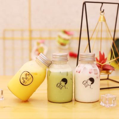 China Recyclable Beverage Juice PET Bottle Cold Pressed Milk Bottle Food Grade Plastic Screen Printing 270ml 500ml With Safety Cap 11oz for sale