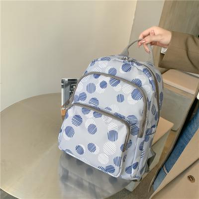 China 2022 New Style Waterproof Fashion Joker Large Oxford University Waterproof Backpack Printing Design Travel School Bags For Girls for sale