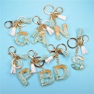 China New Eco-friendly Exquisite Resin 26 Letter Keychains Charm For Women Gold Foil Handbag Ornaments Accessories Tassel Key Rings for sale